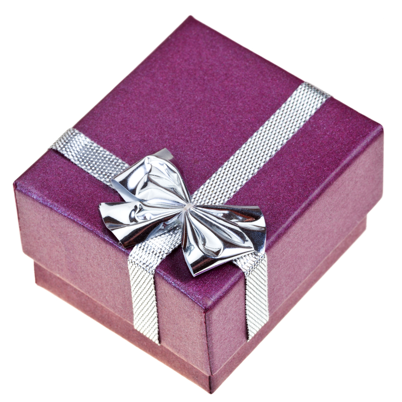 small purple gift box with silver bow 