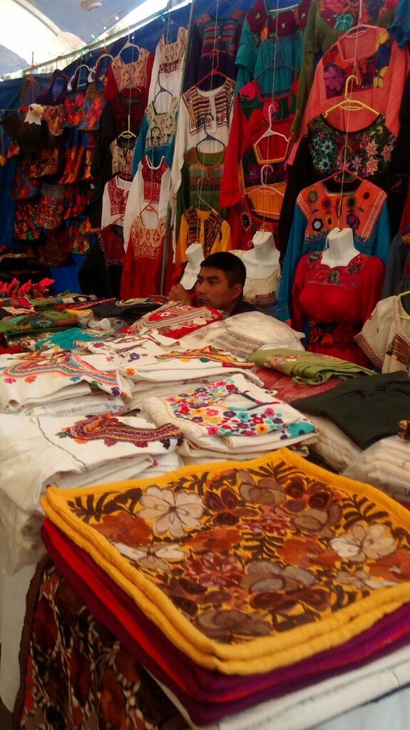 Hand embroidered clothing and accessories sold by a local artisan