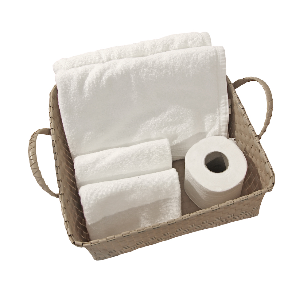 bath towels and toilet paper in basket 