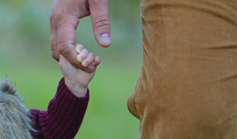 parent and child holding hands