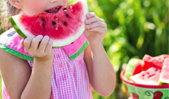 child eating watermelon
