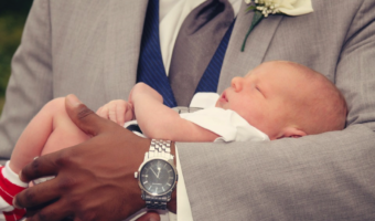 holding infant