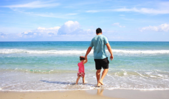 dad and kid on beach