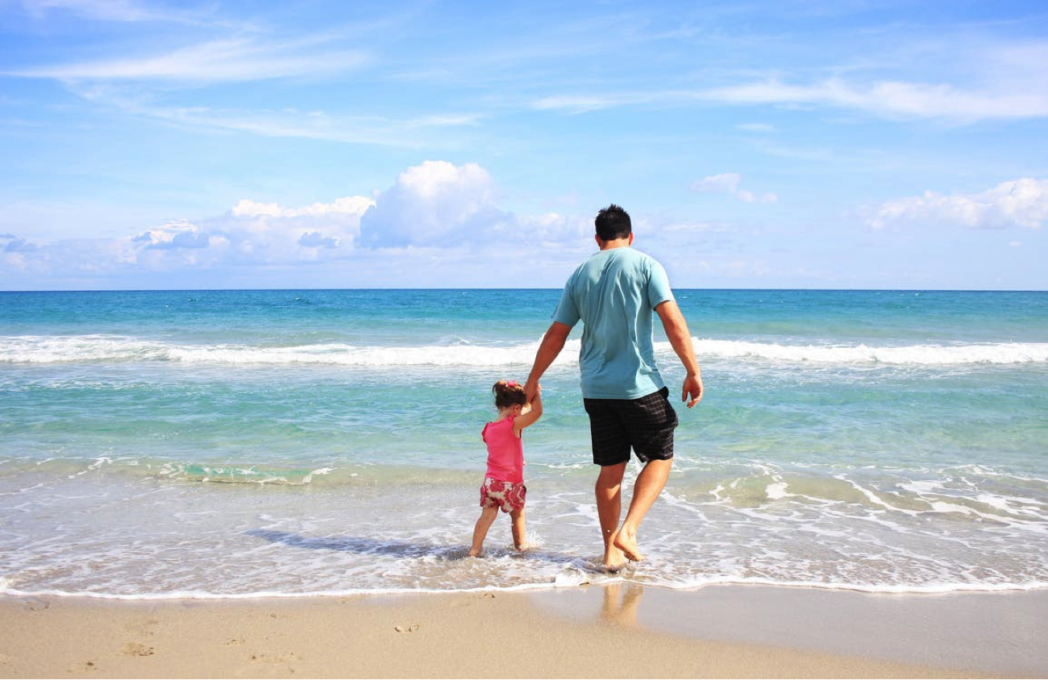 dad and kid on beach