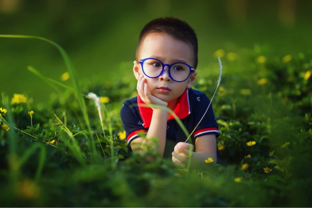 kid in grass
